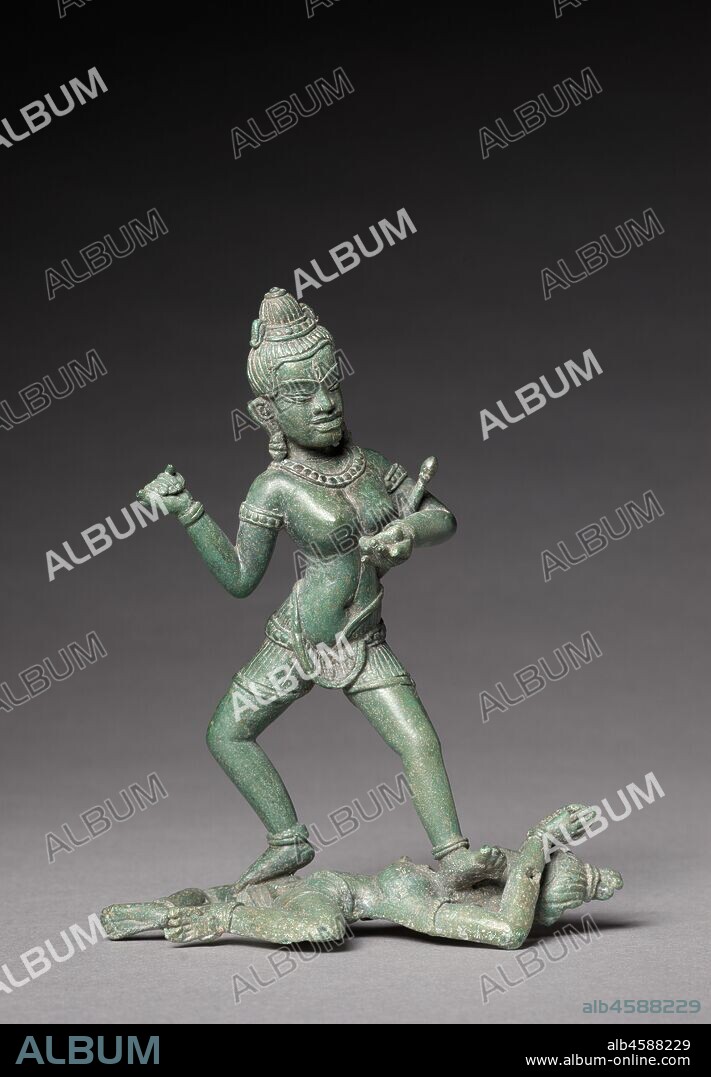 A Dakini, c. 1100. An extremely rare bronze of a tantric Buddhist deity depicts the trampling of the personifications the of the afflictions that keep beings cycling around the world of samsara, moving from one unhappy birth, death, and rebirth to another. This female deity appears to hold a skull cup in her left hand, with a mace in the crook of her elbow, and she grasps an unclear object that may be a flaying knife in her upraised right hand.