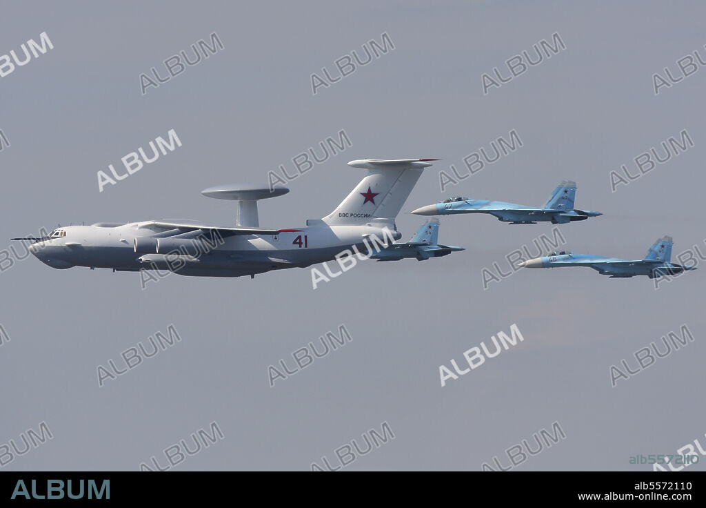 Group of an A-50 AWACS airplane and Su-27 jet fighters of Russian Air Force during Victory Day parade, Moscow, Russia.