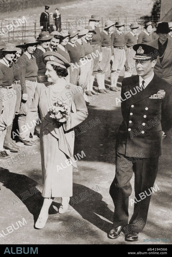 George VI and Queen Elizabeth inspecting members of the Women's Land Army in 1942 during WWII.  George VI, 1895 - 1952.  King of the United Kingdom and the Dominions of the British Commonwealth.   Queen Elizabeth, The Queen Mother.  Elizabeth Angela Marguerite Bowes-Lyon, 1900 - 2002.  Wife of King George VI and mother of Queen Elizabeth II.