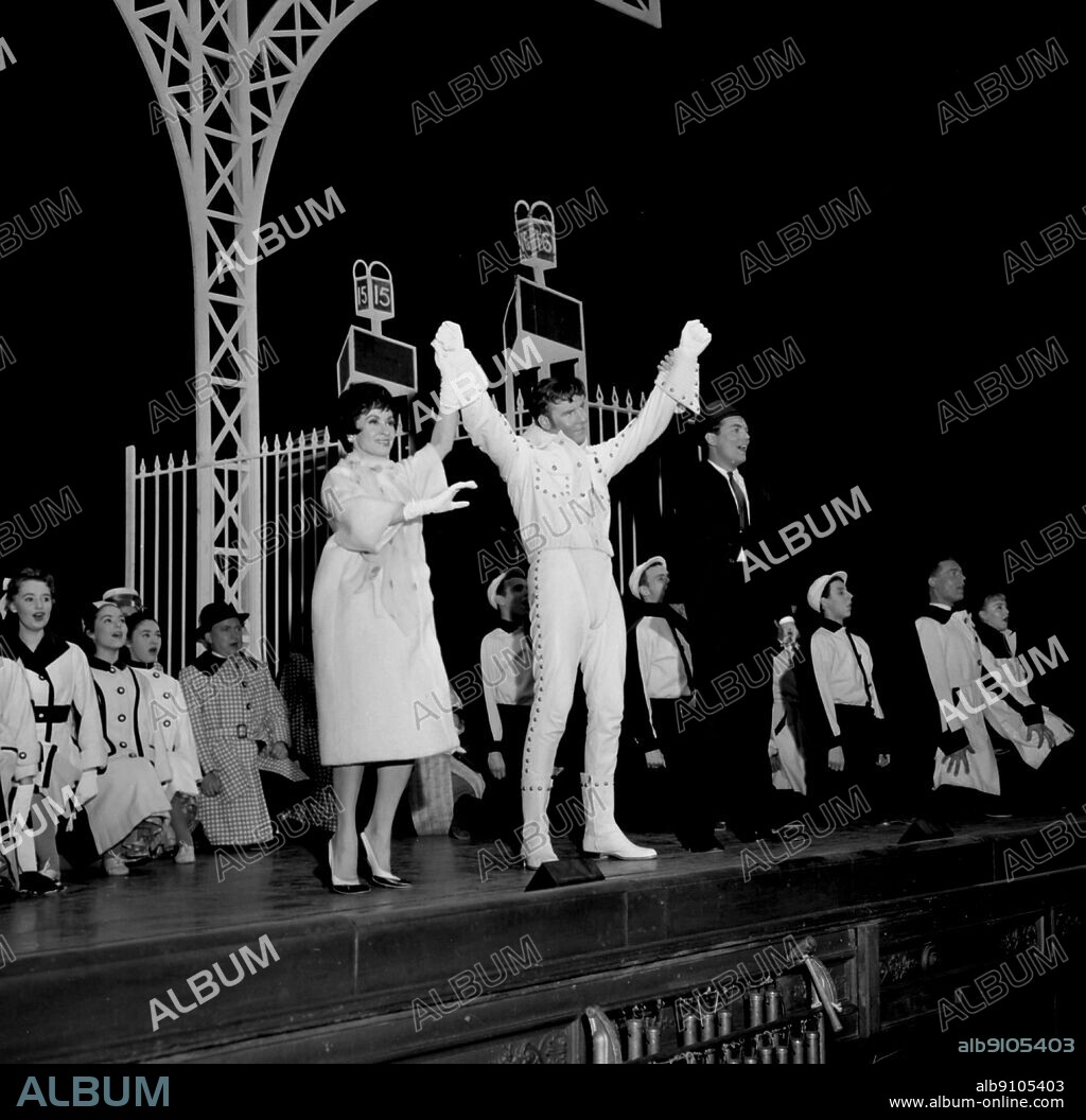 15th June 1961: Marty Wilde (centre stage in white) stars in the musical, "Bye, Bye Birdie" at London's Haymarket Theatre. To his left is Chita Rivera and to his right, Peter Marshall. Wilde plays a rock 'n' roll star in the show.