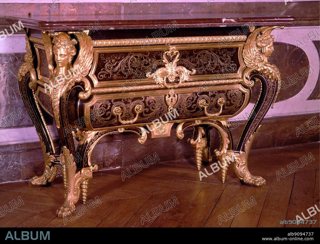 Boulle commode made for Louis XIV room at the Grand Trianon 1701. Rococo carving bowed legs, acanthus leaf decoration, french sphinxes at corners. The Sun King by Nancy Mitford, page 176. The Grand Trianon is a royal villa situated to the north of the Palace of Versailles gardens, in France. The villa was built in 1687 as a retreat for King Louis XIV of France.