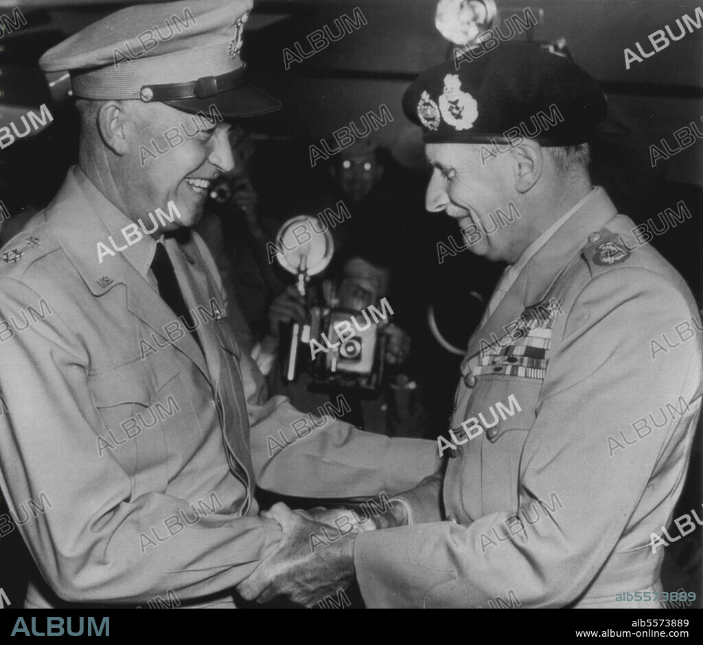 Eisenhower Greets Montgomery -- Arriving at National airport late this afternoon, Field Marshal Viscount Montgomery (right), Chief of British General Staff, is greeted with handicap and smile by General Dwight Eisenhower (left), Chief of staff, U.S.A. September 10, 1946. (Photo by AP Wirephoto).