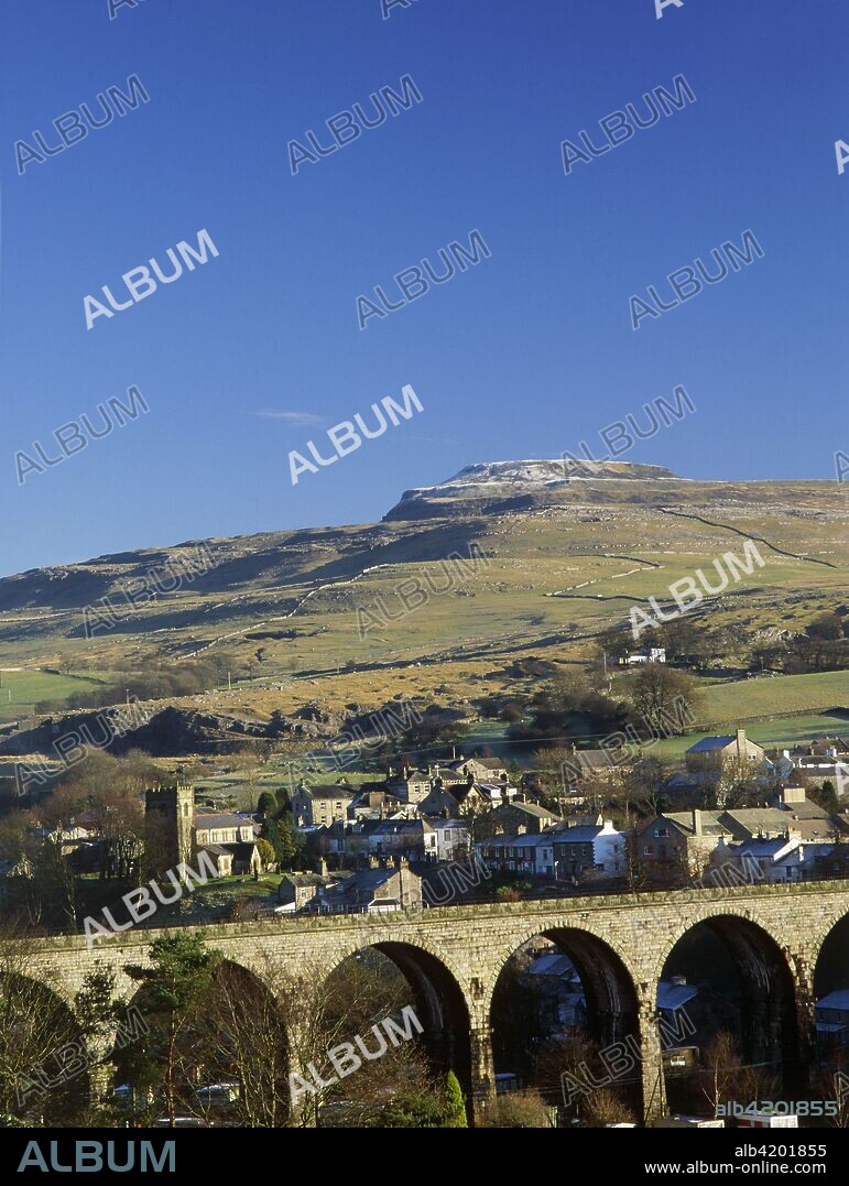 Ingleborough Iron Age Hill Fort, North Yorkshire, 2010. View across to the village of Ingleton, showing the viaduct and Ingleborough Hill Fort behind.