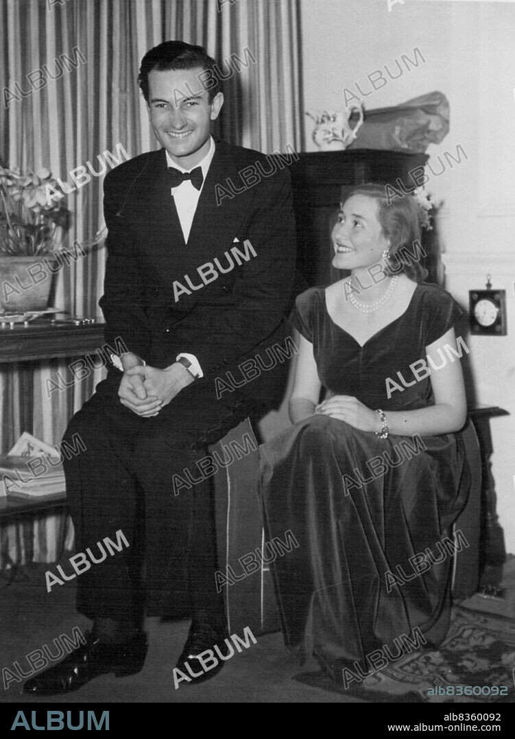 Lord St. Just - Lord St. Just, 6ft. lin. baron did not want to go to a dance at a country house party. "I'm no dancer" he told friends. Their reply was "Don't be a spoil-sport". The twenty-five-year-old peer-family motto "Honest duty" - went to the dance. There he saw a school girl of the sixteen in a pink and white organdie dress - Leslie Nast daughter of the late Conde Nast, American publisher, back from Switzerland for the holidays. At first he hesitated to approach her. But when, at last he asked her to dance she did not seem to mind. February 14, 1949. (Photo by Daily Mirror).