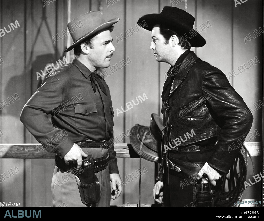 BRIAN DONLEVY and ROBERT TAYLOR in BILLY THE KID, 1941, directed by DAVID MILLER and FRANK BORZAGE. Copyright M.G.M.