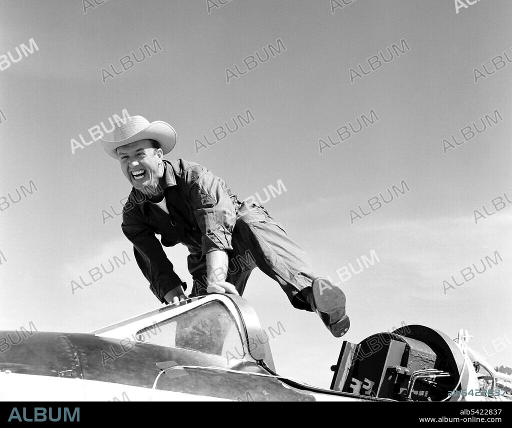 Pilot Joe Walker and the X-1A, California, USA, 1955. Cowboy Joe (NACA High-Speed Flight Station test pilot Joseph Walker) and his steed (Bell Aircraft Corporation X-1A). A happy Joe was photographed at Edwards Air Force Base. The X-1A was flown six times by Bell Aircraft Company pilot Jean "Skip" Ziegler in 1953. Air Force test pilots Major Charles "Chuck" Yeager and Major Arthur "Kit" Murray made 18 flights between November 21, 1953 and August 26, 1954. The X-1A was then turned over to the NACA. Joe Walker piloted the first NACA flight on July 20, 1955. Walker attemped a second flight on August 8, 1955, but an explosion damaged the aircraft just before launch. Walker, unhurt, climbed back into the JTB-29A mothership, and the X-1A was jettisoned over the Edwards AFB bombing range.