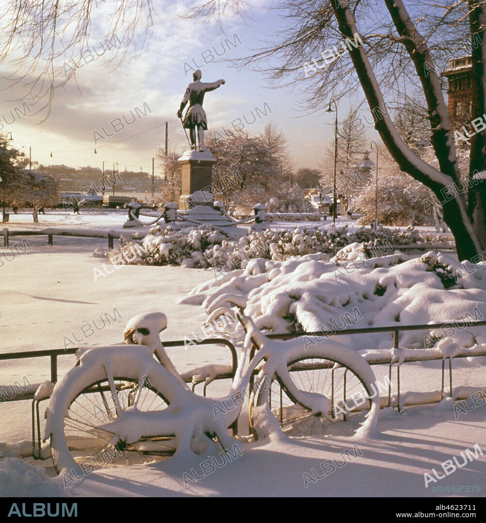 Kungstradgarden (The Royal Garden) Stockholm in winter, 1968. The statue of king Karl XII (1682-1718) was sculptured by Johan Peter Molin (1814-73) and uncovered in 1868.