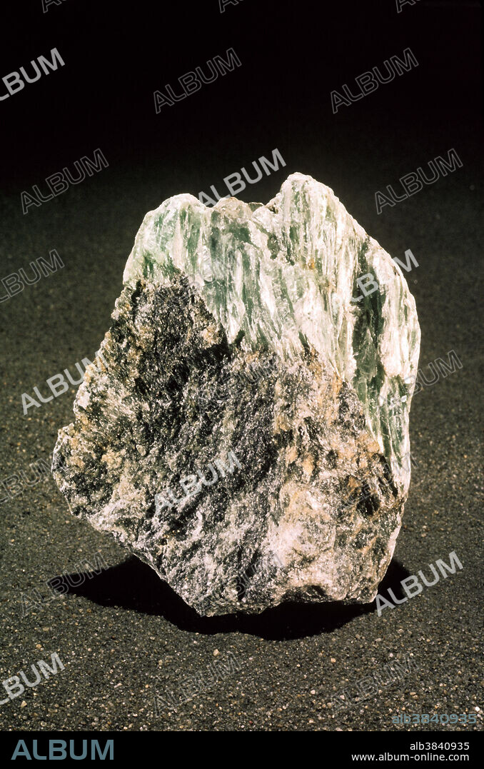 Talc, hydrous magnesium silicate, is the softest known mineral and is number 1 on the Mohs hardness scale. When ground up into fine particles, it is sold as 'talcum powder' and used as a drying agent. It forms as an alteration product of other silicates in localities worldwide. Talc is usually massive or 'foliated' (in sheets) and has a pearly luster and a 'soapy' or greasy feel. The material found in digging the Hoosac Tunnel in Massachusetts is extremely typical of the species.