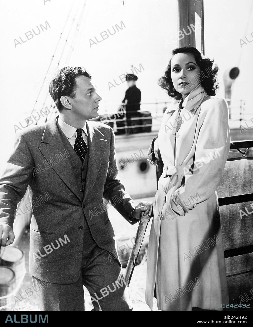 DOLORES DEL RIO and JOSEPH COTTEN in JOURNEY INTO FEAR, 1943, directed by NORMAN FOSTER. Copyright RKO.