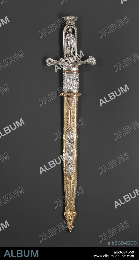 Hunting Sword with Scabbard. Culture: French, Paris. Dimensions: L. with scabbard  23.8 in. (63 cm). Date: ca. 1851.
This hunting sword is a masterpiece of the Gothic Revival style and a virtuoso demonstration of mid-nineteenth-century design and craftsmanship, which were greatly stimulated by the series of international exhibitions held in London and Paris in the 1840s-60s. It is virtually identical to one executed by an otherwise unrecorded craftsman, Marcet, for the Paris firm of silversmiths and jewelers Marrel Frères, which was shown at the Great Exhibition held at the Crystal Palace, London, in 1851. That sword was especially praised by the exhibition's jurors, who noted that its design "left nothing to be desired." As a measure of their success, Marrel Frères received a medal for their display, and no fewer than five of their objects were purchased by the English commissioners for the new Museum of Practical Art, the forerunner of the Victoria and Albert Museum. The hunting sword was among these, valued at the substantial sum of £200, and is now in the Victoria and Albert Museum (reg. No. 159-1851).
This sword differs from the London example only in an ornamental band around the throat of the scabbard. The grip is fashioned as a deep architectural niche formed of pierced strapwork and foliage, partly gilt, into which is set a figure, cast and chased in the round, of Saint Hubert, patron of the hunt. The cross-shaped guard is inhabited by three dogs, modeled with naturalistic detail, in pursuit of a fox, which cowers at the front of the quillon block; on the end of one quillon an eagle seizes its prey, a crane. The broad, double-edged blade is chiseled with a series of interrupted fullers on each side. The scabbard is of copper, cast and chased with Gothic tracery and gilt by electroplating, an innovative technique that enjoyed great vogue during the mid-nineteenth century. Encircling the top of the scabbard is a silver relief representing the miraculous vision of Saint Hubert; another silver panel in the center of the scabbard is embossed with trophies of the chase. An inscription, MARREL PARIS, is found at the base of the hilt and tip of the scabbard.
From the mid-sixteenth century, the French were unrivaled in the field of highly decorated, deluxe arms. This sword demonstrates that this tradition had not diminished 300 years later.