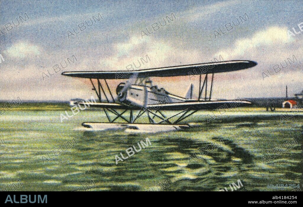 Heinkel HD 42 seaplane, 1920s, (1932). The Heinkel HD 42 50, later designated the Heinkel He 42, was a German biplane seaplane later built for the Luftwaffe. From "Die Eroberung Der Luft", (The Conquest of the Air), cigarette card album produced by the Garbáty cigarette factory, 1932. Eugene and Moritz Garbáty, who were Jewish, were driven out of business by the Nazis in the late 1930s, and forced to sell their factory which lay empty for over 70 years. [Garbaty Cigarettenfabrik, Berlin-Pankow, 1932].
