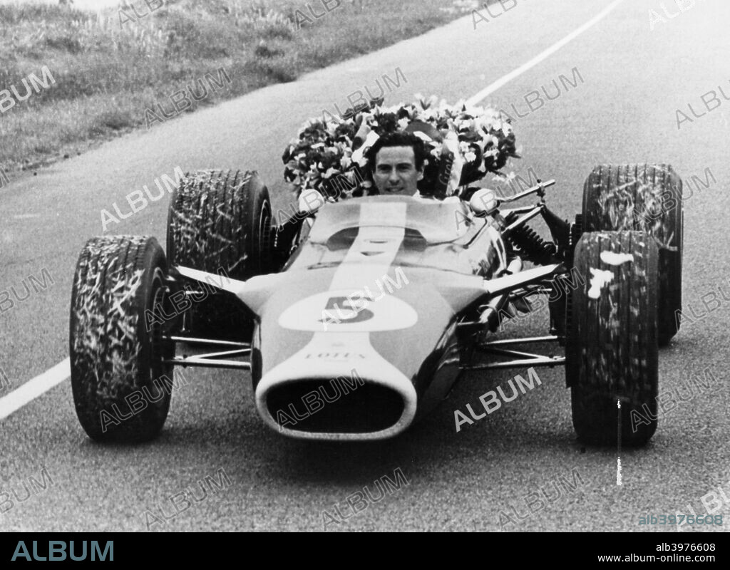 Jim Clark in a Lotus with the winner's laurel wreath. He won the Formula 1 World Championship twice, in 1963 and 1965. Clark drove exclusively for Lotus until his death in a Formula 2 race in Hockenheim, Germany in 1968.
