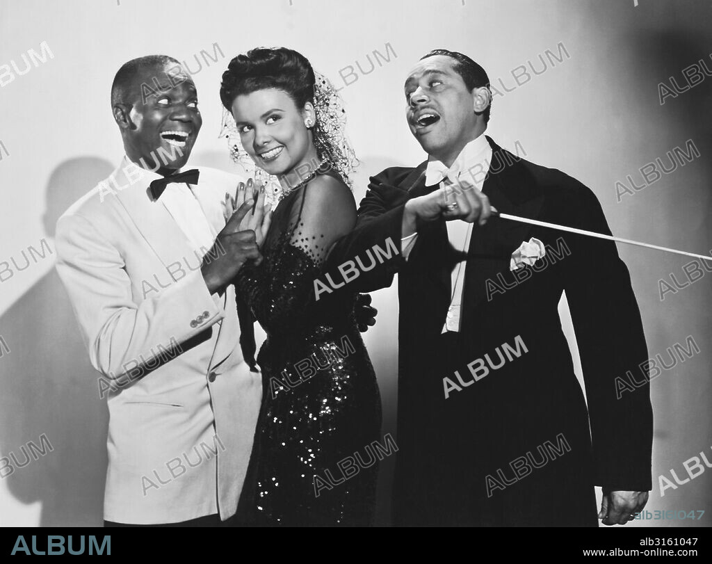 Hollywood, California: 1943 Singer, dancer and actress Lena Horne with Bill 'Bojangles' Robinson (lL) and Cab Calloway (R) in the musical film 'Stormy Weather'.