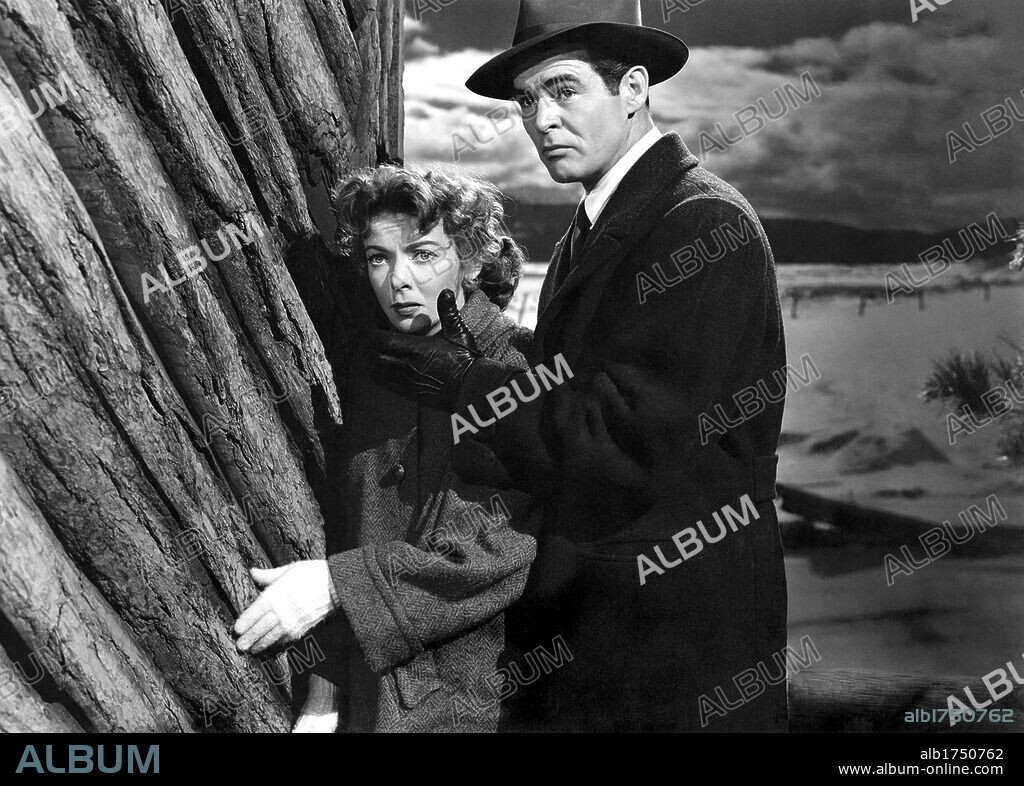 IDA LUPINO and ROBERT RYAN in ON DANGEROUS GROUND, 1952, directed by NICHOLAS RAY. Copyright RKO.