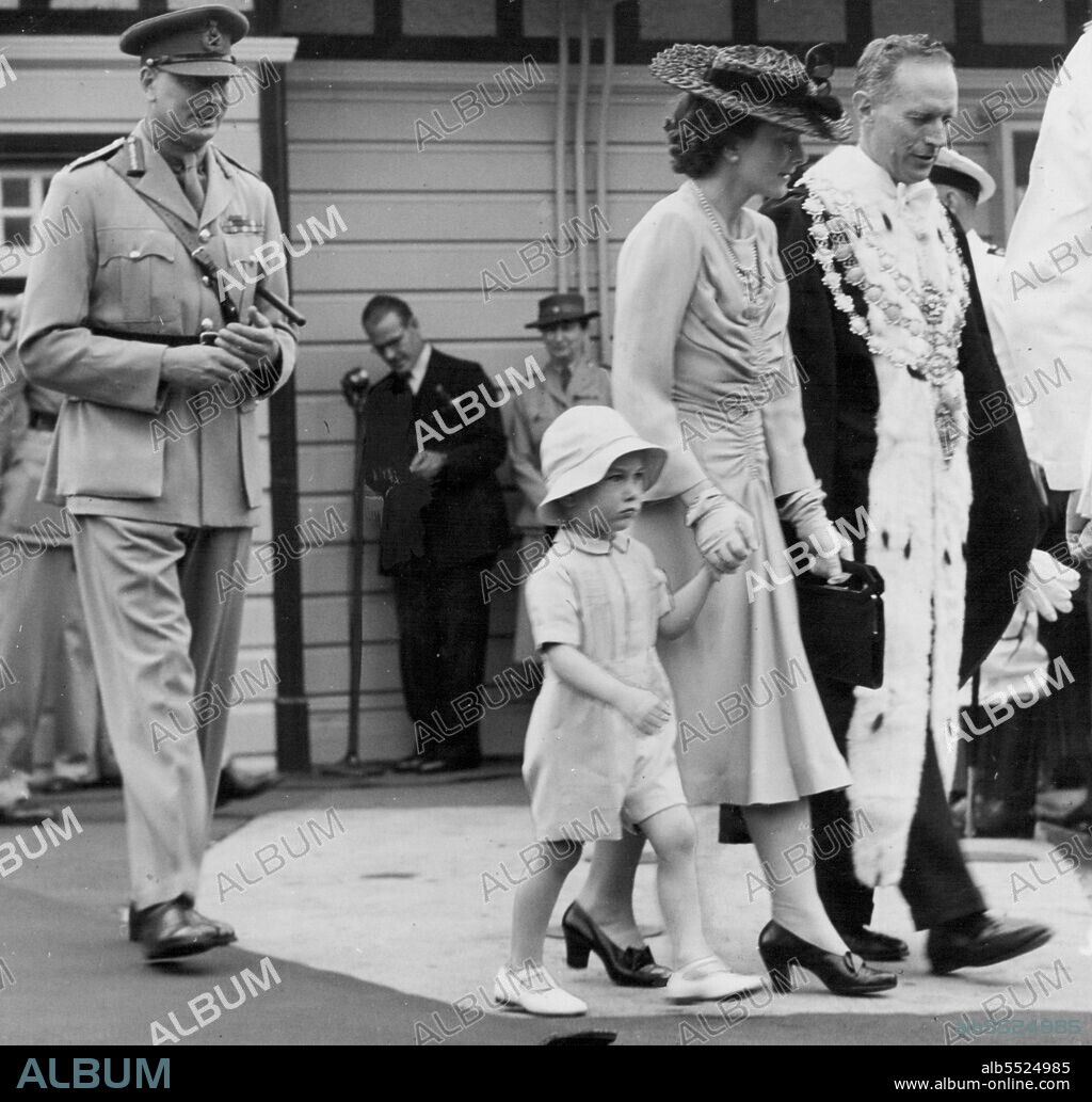 The Duchess of Gloucester with Prince William and the Duke of Gloucester, accompanied by the Lord Mayor of Sydney, Alderman Neville Harding, walking to their car after receiving the address of welcome *****. January 30, 1945.