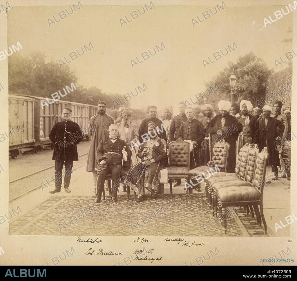 UNKNOWN. The Resident, Colonel William Prideaux and Maharaja Sawai Madho Singh, with officials at the railway station, Jaipur. Stotherd Collection: Album of miscellaneous views in Rajasthan. c. 1895. Photograph. Source: Photo 448/5(100).