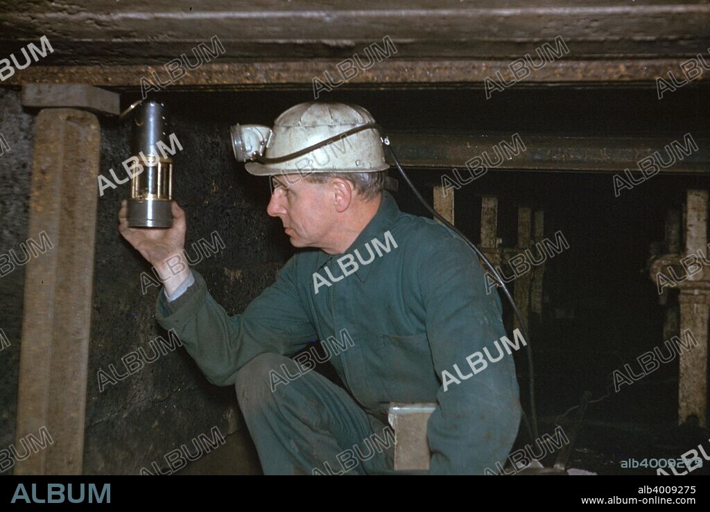 Pity Deputy tests for gas using Davy Safety Lamp before shotfiring.