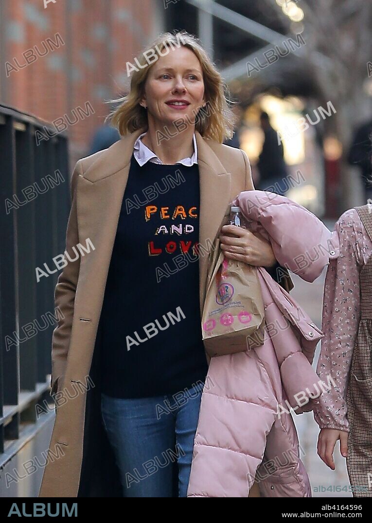February 6, 2019 - New York, New York, United States - Actress Naomi Watts wears a 'Peace and Love' sweater as she walks with a young person in Tribeca on February 5 2019 in New York City. 06/02/2019