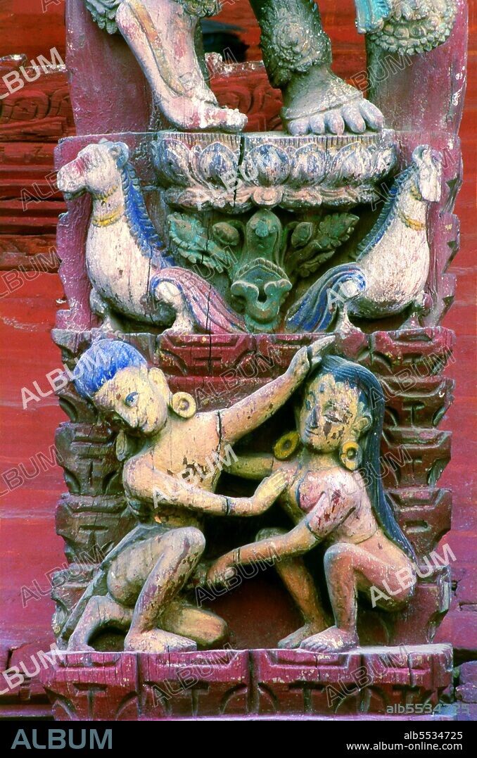 Immediately west of the Royal Palace entrance gate, the rusty-red Jagannath Temple, built in 1653 by Mahendra Malla, enshrines a figure of the Chaturmurti Vishnu, the 'Four-Figured Vishnu'. This particular form of Vishnu is also called Jagannath, 'Lord of the World', and the etymological root of the English word 'juggernaut'. The main shrine in the Jagannath Temple is accessible only to priests. The large struts under the roof are covered with erotic carvings. These carvings, which are fairly crudely executed, occupy the base of larger and more refined carvings representing gods and goddesses. The latter are dressed in regal finery, adorned with crowns and jewellery, and wear serene expressions on their faces.