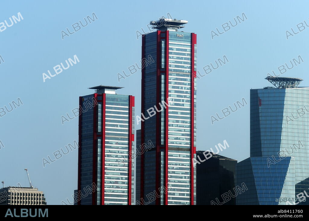 The Parc 1 Tower (with red piping), is a supertall skyscraper in Seoul, South Korea. It stands 333 m (1,093 ft) and contain 69 floors. Construction stopped in 2011 but resumed in early 2017. Yeouido Han River Park, in Seoul, South Korea.