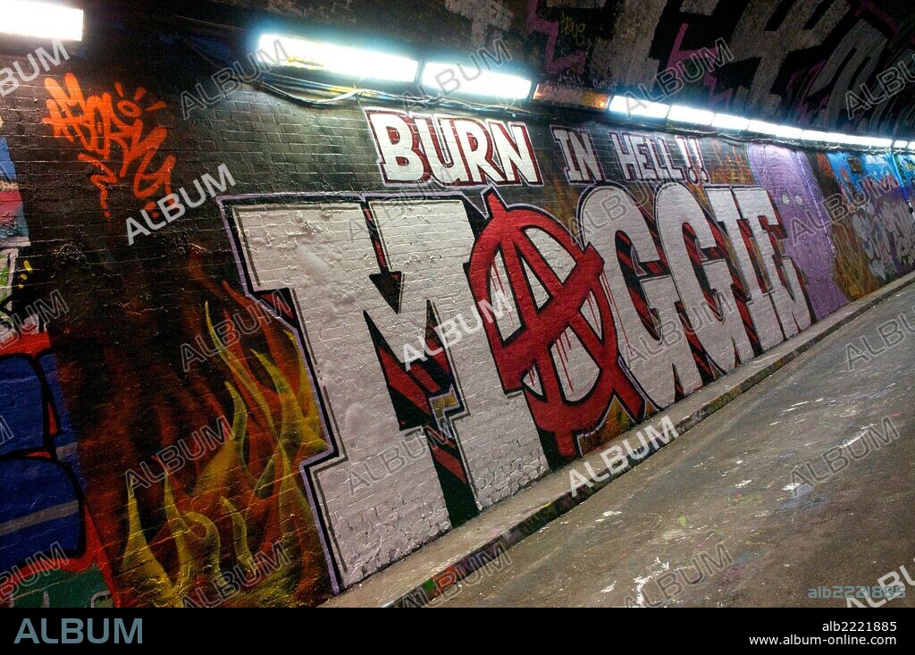 LONDON, UNITED KINGDOM 11.04.13. Large graffiti Burn in Hell Maggie piece with an anarchist symbol on Leake Street near Waterloo Train Station on Thursday 11 April 2013 in London, England. The former Conservative Party Prime Minister Margaret Thatcher died at the Ritz Hotel early in the week.