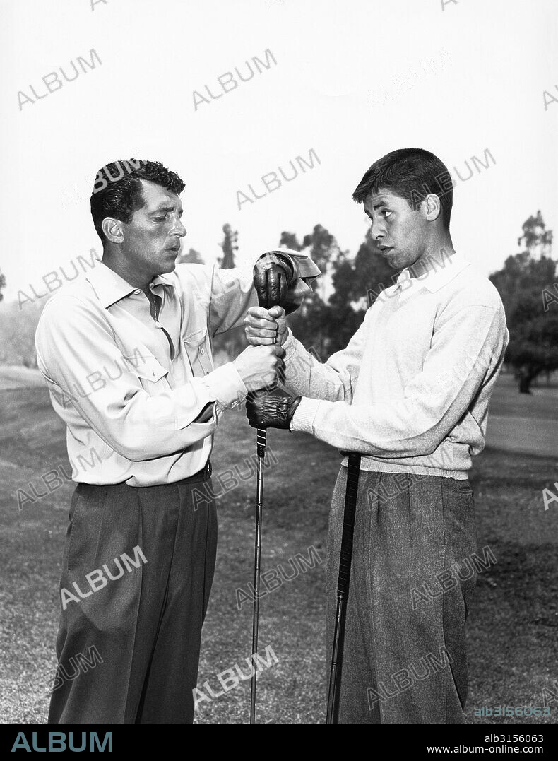 California:  c. 1953 Dean Martin appears to get the best of Jerry Lewis with his hand grabbing the top of the golf club.