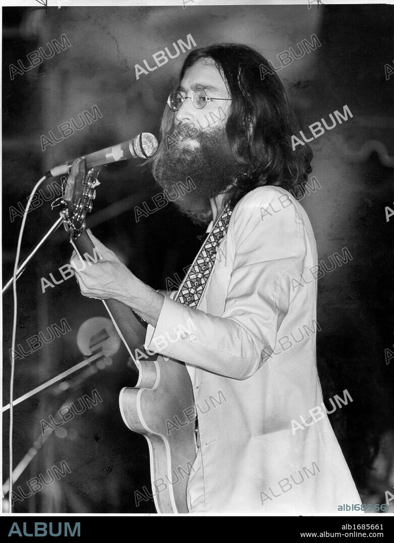 John Lennon performs in 1969 with the Plastic Ono Band onstage at Varsity Stadium. Tony hauser photo/Toronto Star 20090912;ON;Insight;IN2 -- Tony Hauser toronto star file photo Beatles fans will remember the Rock 'n' Roll Revival, Sept. 13, 1969, at Varsity Stadium, as a day of infamy. But for John Lennon, playing with Yoko Ono meant ''I could do it on my own,'' as he told Peter Goddard...20000404;MET;News;A1 -- TONY HAUSER/TORONTO STAR FILE PHOTO - GOING SOLO: - John Lennon appeared at Varsity Stadium in 1969....20000404;ONT;News;A1 -- TONY HAUSER/TORONTO STAR FILE PHOTO - GOING SOLO: - John Lennon appeared at Varsity Stadium in 1969....19690915;MET;entertainment;xx -- John Lennon and his wife, Yoko Ono, flew from London to Toronto on Saturday to put in an appearance at the Rock & Roll Revival. On stage, Yoko's unmusical wails and whoops almost drove the crowd insane with boredom. (Credit Image: © The Toronto Star/ZUMA Press). 13/09/1969