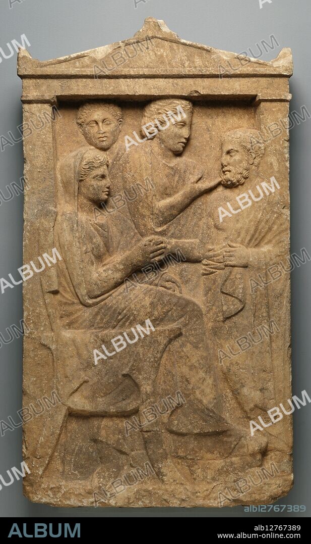 Grave Naiskos of Sime, about 320 BC. Gravestone of Sime.   Additional Info: A deceased woman, identified as  Sime by the inscription carved on the lintel above her, sits amid her family on this Athenian grave stele or tombstone. She sits on a chair with her feet on a footstool, while her husband approaches and shakes hands with her. Another woman and a young man, presumably her children, watch the scene from the background. The handshake was a popular symbolic gesture on Classical Greek gravestones, representing family unity even after death. In the background, the standing daughter reaches forward and touches the father's chin in another common funerary gesture. The stele is carved in the shape of a naiskos or small funerary building. This kind of stele was one of the main types of funerary monuments in Athens in the later 300s BC.