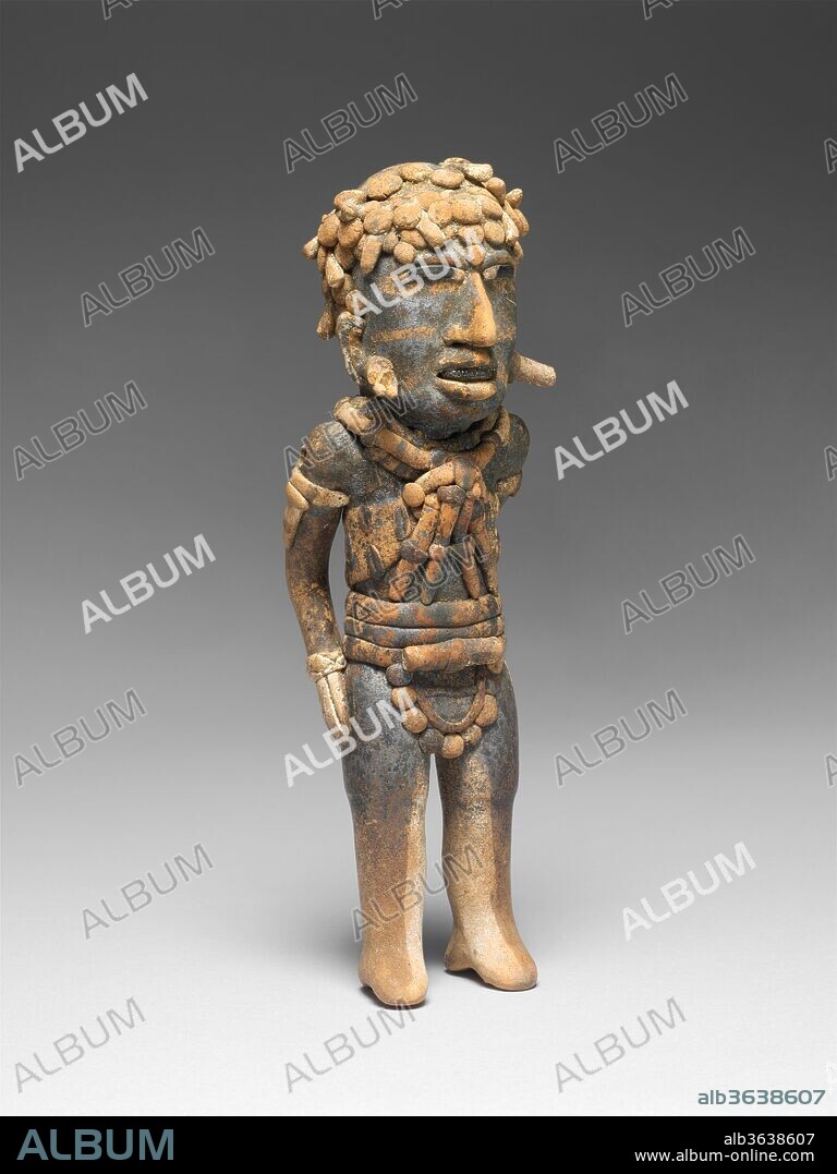 Figure. Culture: Veracruz. Dimensions: H. 8 1/4 x W. 2 5/8 x D. 2 1/4 in. (21 x 6.7 x 5.7 cm). Date: 7th-10th century.
The modern state of Veracruz lies along the Mexican Gulf Coast, north of the Maya lowlands and east of the highlands of central Mexico. Culturally diverse and environmentally rich, the people of Veracruz took part in dynamic interchanges between the three regions that over the centuries included trade, warfare, and migration. During the middle centuries of the first millennium, the artistically gifted Veracruzanos created particularly inventive ceramic sculpture in diverse yet related styles. Each of these three standing figures is unique, but they share many details: the curled hair (or hats with curls) with traces of white coloring, the barlike chest ornaments, the projecting ear ornaments, and the elaborate belts or loincloths. The wide mouths are open to show off sparkling teeth that have been blackened with hematite crystals, which are rare on Veracruz ceramic figures. The black pupils of the wide eyes, on the other hand, are a resinous material called <i>chapapote</i> that is not uncommon on Veracruz figures. The varying details on the costumes give the figures an odd appearance of rank, as if they were performers of some kind or military men in dress uniform. It is a narrative note unusual among groups of ceramic figures of this period.
