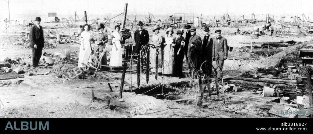 The Ludlow Massacre was an attack by the Colorado National Guard and Colorado Fuel & Iron Company camp guards on a tent colony of 1,200 striking coal miners and their families at Ludlow, Colorado on April 20, 1914. In 1914, when workers at Colorado mine went on strike, company guards fired machine guns and killed several men. More battling followed, during which 2 women and 11 children were killed and John D. Rockefeller Jr., the chief mine owner, was pilloried for what had happened. In retaliation for Ludlow, the miners armed themselves and attacked dozens of mines over the next ten days, destroying property and engaging in several skirmishes with the Colorado National Guard along a 40-mile front. The entire strike would cost between 69 and 199 lives. Congress responded to public outcry by directing the House Committee on Mines and Mining to investigate the incident. Its report, published in 1915, was influential in promoting child labor laws and an eight-hour work day. Photograph originally captioned: Red Cross workers at the ruins of Ludlow, Colorado, tent city.