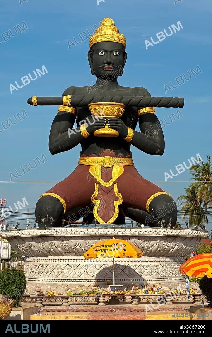 Statue of Ta Dambong, a black man with a magic wand, symbol of the provincial capital of Battambang, Cambodia, Southeast Asia, Asia.