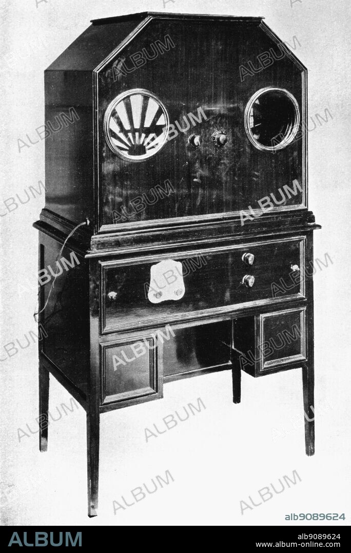 1928 Baird TV set - Televisor Model C - comprises a dual television and super radio set combined with a moving coil loud speaker, fitted in a handsome case, forming a complete self-contained unit for the simultaneous reception of vision and music, singing or speech. List price (ex workds) £150, packing and carriage extra.. ©TopFoto.