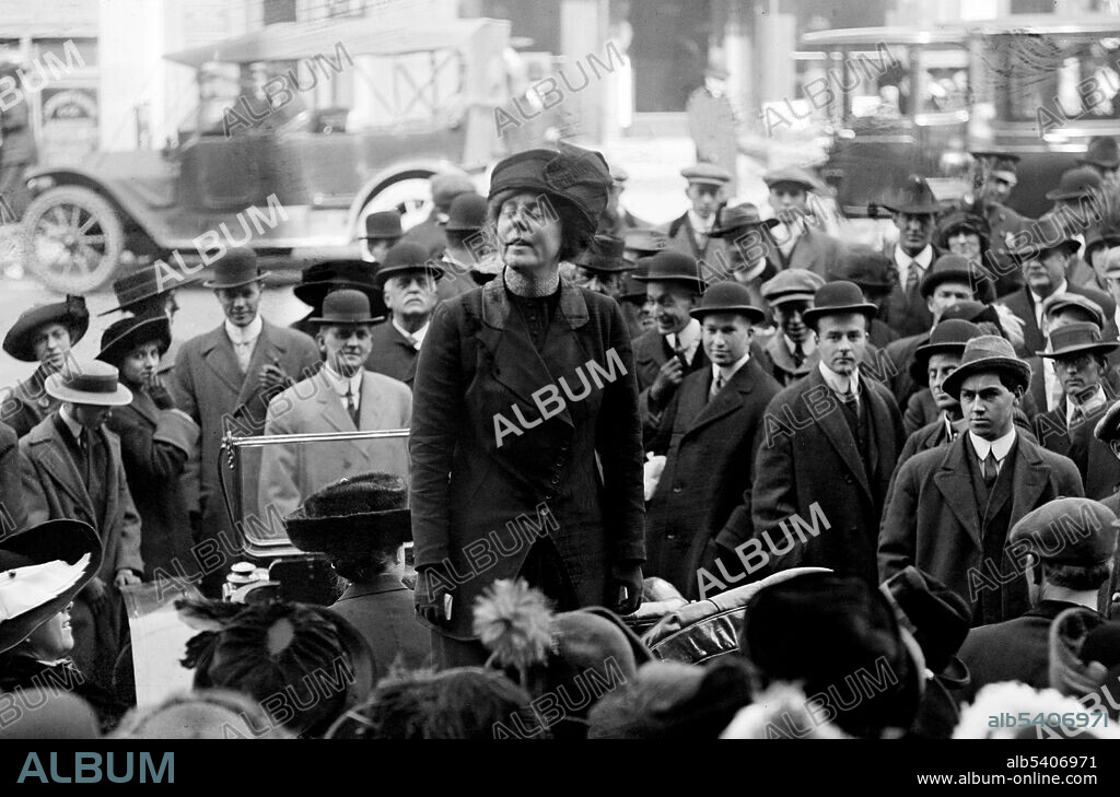 Burns addressing crowd of men. Lucy Burns (July 28, 1879 - December 22, 1966) was an American suffragette and women's rights advocate. Burns met Alice Paul while in England where they were arrested twice, imprisoned, went on hunger strikes and were force fed. Upon returning to the US they joined the NAWSA, but their ideas were too radical and together they formed National Woman's Party. Burns was arrested in 1917 while picketing the White House and was sent to Occoquan Workhouse. After the women of the United States gained the right to vote, Burns retired from political life and devoted herself to the Catholic Church and her orphaned niece. Bain News Service, undated (cropped and cleaned).