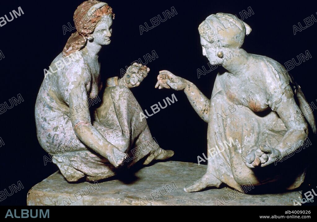 Terracotta group of knucklebone (astragalos) players, Hellenistic Greek,  c330-c300 BC. The two figures play a game similar to the modern game of 'jacks'. From the British Museum's collection.