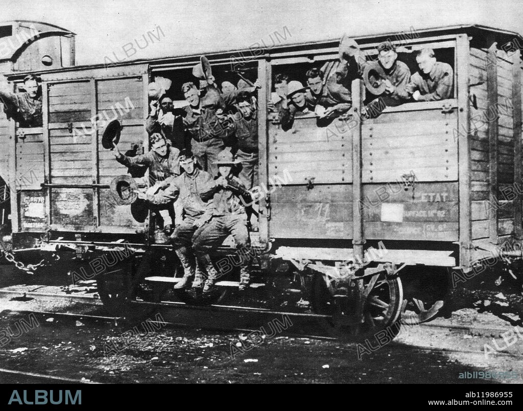 World War 1 Box Cars transporting 40 men , 8 horses .