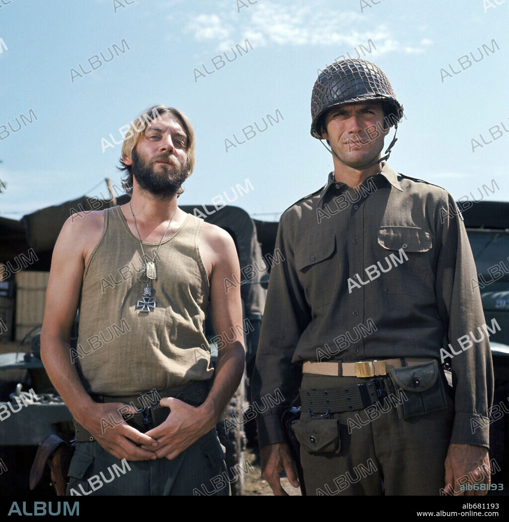 CLINT EASTWOOD and DONALD SUTHERLAND in KELLY'S HEROES, 1970, directed by BRIAN G. HUTTON. Copyright M.G.M.