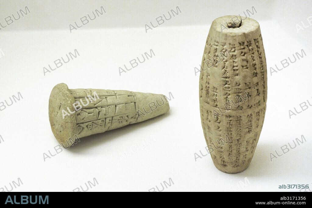 Near East. Mesopotamia. Clay cone with an inscription of Gudea. Lagash. 22nd Century BC. Clay cylinder with an inscription of Nebuchadnezzar II. Babylonia. 6th BC. The State Hermitage Museum. Saint Petersburg. Russia.