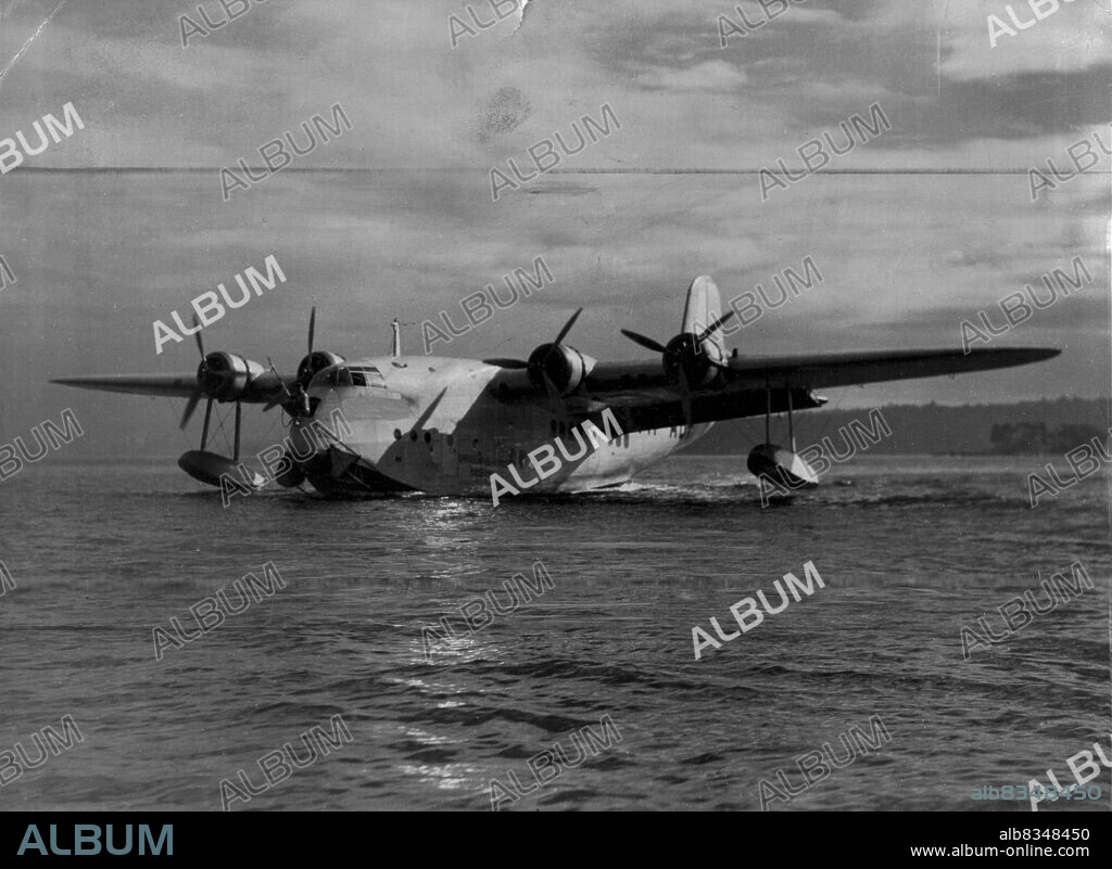 Qantas Empire Airway Flying Boat, "Cooee", taxis to the morning at Rose Bay. April 26, 1939. (Photo by Russell Roberts Pty. Ltd.).