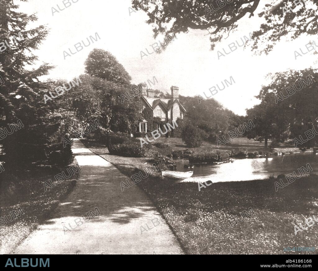 York Cottage, Sandringham, Norfolk, 1894. The cottage, in the grounds of Sandringham House, was built as an overflow for the royal residence. It was given by the future King Edward VII to his son Prince George, the Duke of York (later King George V) in 1893. From Beautiful Britain; views of our stately homes. [The Werner Company of Chicago, 1894].