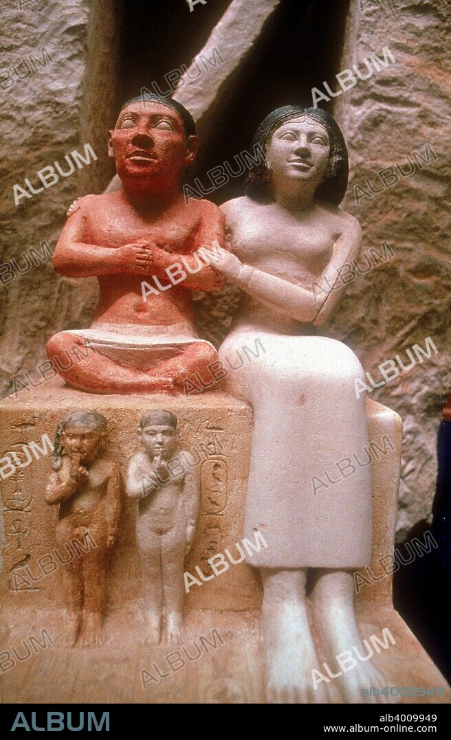 The dwarf Seneb with his wife and two children, Giza, 5th Dynasty. It is from a tomb in Giza and is now part of the Egyptian Museum collection in Cairo.