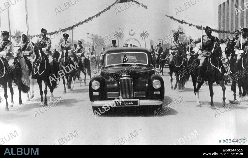 King-Designate Visits Tripoli State Drive Through the Future Capital of Independent Libya -- In January 1952 the three territories of Tripolitania, Cyrenaica and the Fezzan will become united into one independent state under the rule of King Sayyed ed Idris el Senussi, This will be in conformity with the United Nations decision on the future of these three ex-Italian colonies. Recently the King-designate witnessed ample evidence of his popularity when he paid a visit to his future capital, Tripoli.Tripoli was beflagged and the streets festooned with streamers for the first State visit of Emir Sayyed. June 27, 1951.