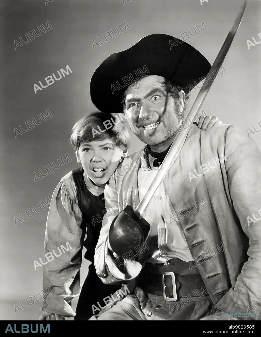 BOBBY DRISCOLL and ROBERT NEWTON in TREASURE ISLAND, 1950, directed by BYRON HASKIN. Copyright DISNEY/RKO.