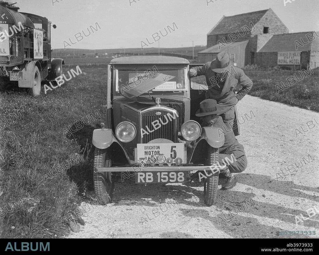 Wolseley  Hornet saloon 1930 1271 cc. Reg. No.  RB1598. Entry No: 5. Driver: Douglas-Morris, D.E.M.  Car known as Boy Blue 2. Car colour is cream top with blue below waistline. B&HMC Brighton Motor Rally. Date: 28.6-1.7.30.