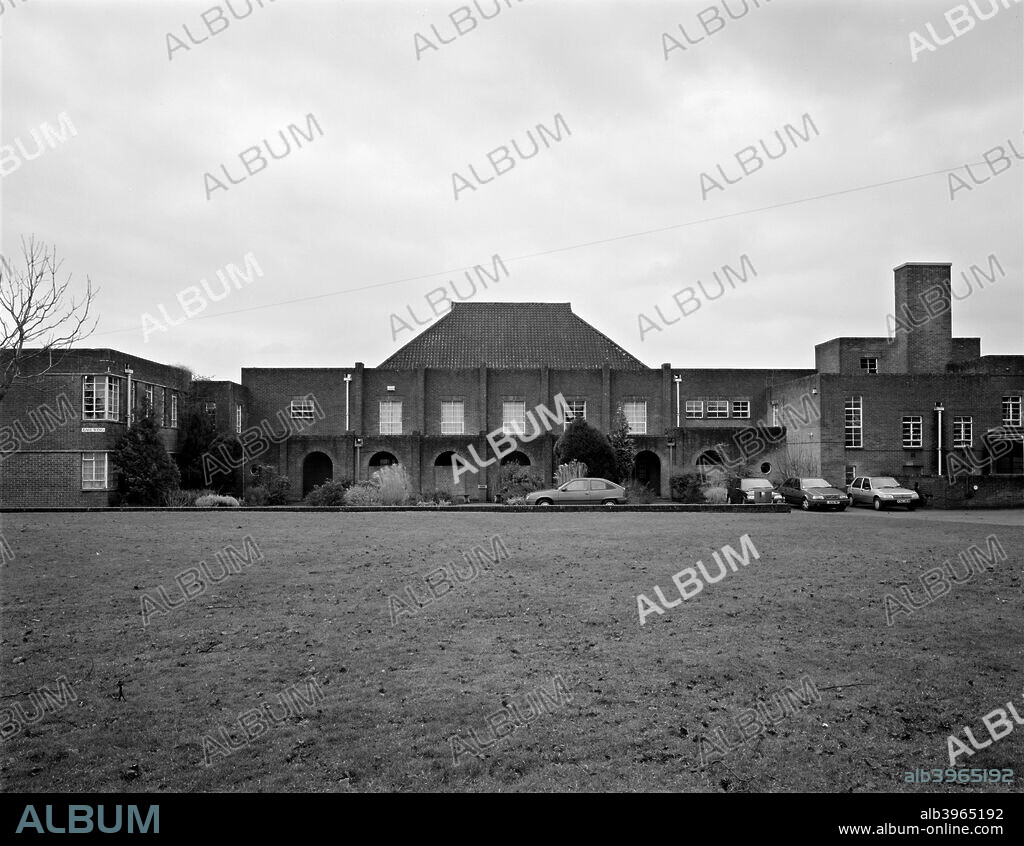 Hardenhuish School, Hardenhuish Lane, Chippenham, Wiltshire, 2000. A general view of the school buildings, with a number of cars parked outside. The school has occupied it present site in the parkland of the former Hardenhuish Manor since 1935. The Georgian manor is now part of the school campus.