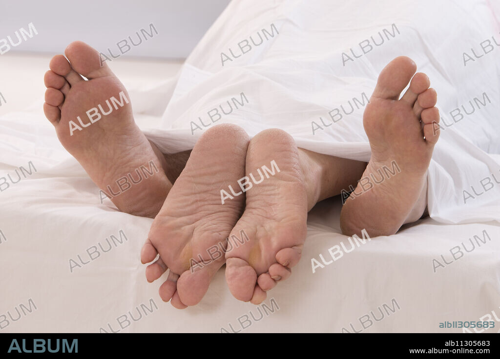 Senior couple in bed.