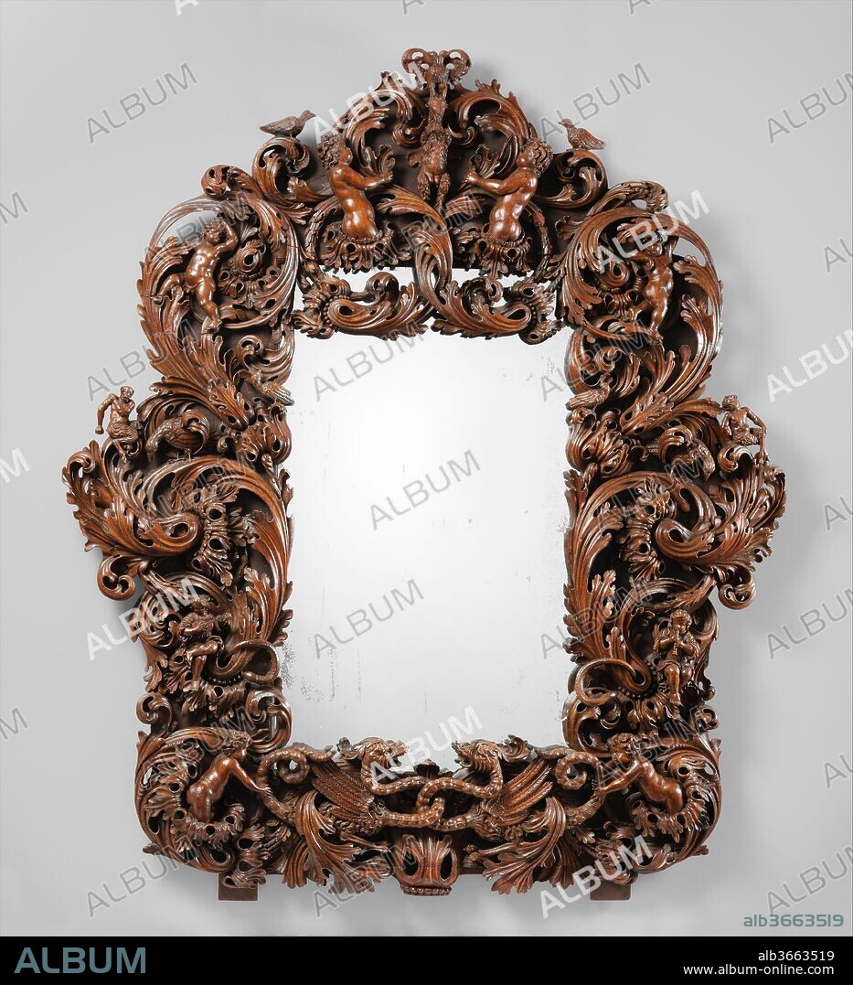 Mirror. Culture: German, Danzig (Gdansk). Dimensions: 75 x 64 x 4 in.  (190.5 x 162.6 x 10.2 cm). Date: ca. 1680-1700.
Large parade mirrors became increasingly fashionable throughout Europe during the Baroque period, and they were often conceived as part of an ensemble, with matching console tables and candlestands. This development was supported by technical advances that made it possible to produce larger plates of mirror glass and driven by the ambition of princes to imitate the magnificent Galerie des Glaces in the suite of state rooms at Versailles, created in 1681-84 by Charles Le Brun (1619-1690) for Louis XIV of France.[1]
At the end of the seventeenth century, goods and artistic ideas flowed through northeastern Europe along trade routes that connected English and Netherlandish ports with the cities along the Baltic Sea and points east. The latest fashions were eagerly received and copied as closely as local craftsmen could manage and local patrons could afford. This mirror was once believed to be of Dutch origin,[2]  but its putti nestled among a tangle of jaggedly lobed acanthus leaves have proved to be very similar to works in wood by the cabinetmakers and virtuoso carvers of the independent town of Danzig, one of the most prosperous trade centers on the Baltic seacoast and a gateway to Russia. Large quantities of household goods, such as Dutch case furniture and English chairs,[3] were imported into Danzig during the seventeenth and eighteenth centuries, as were luxury items like the popular Chinese blue-and-white porcelains. The grotesque dragon-monsters on this mirror, with their intriguingly intertwined necks and long tails, were obviously inspired by the decorations on the porcelain exported from East Asia. Dragons have been part of both Eastern and Western imagery for millennia, but seventeenth-century European craftsmen were probably unaware of their symbolism as water deities in the East and of Satan in the West. 
This frame offers an ingenious combination of decorations from both traditions. The elements of chinoiserie are dominated by the acanthus-leaf ornament, however, which was especially popular in Europe at just the time this mirror was made.[4] The plant's twisting and luxuriant pattern of growth fulfilled the Baroque period's desire for ornate and extravagant ornamentation. The acanthus designs by the French engraver Jean Le Pautre (1618-1682) and by his follower Paul Androuet Ducerceau (1630-1710)[5] were adapted and exaggerated by such ornamentists in the German-speaking world as the Viennese court cabinetmaker Johann Indau (1651-1690)[6] and the Augsburg masters Johann Unselt and Johann Conrad Reuttimann.[7] In Bohemia and parts of Silesia, acanthus decoration was taken to an unprecedented extreme in the altarpieces called Akanthusaltäre. These were conceived in the pure spirit of ornamental fantasy, as the rioting vegetation completely conceals the function of the objects it decorated.[8] In the entrance and banquet halls of grand town houses the acanthus crept across chairs, tables, and large armoires and up staircases and along wall paneling; in the form of stucco ornament it also decorated ceilings. The result was an impressive decorative unity that transmitted a feeling of lushness and prosperity, which reflected the owner's social status.[9]
A rich and varied display of acanthus ornament covers the structural elements of the Museum's piece. Bold sprays on the sides break up its rectangular shape, and shorter tendrils frame the uprising crest, giving it that expressive contour so characteristic of the late Baroque style. Almost hidden in the leaves are small figures with symbolic meaning. Several putti hold the dragons' tails, and others face a double-headed eagle and a goat located in the crest. The eagle may refer to the Holy Roman Empire. The goat undoubtedly is the heraldic device of the mirror's first owner, but since the rampant goat is featured in the coat of arms of many noble families in Danzig, Pomerania, and Mecklenburg, this person has not been identified. Putti and doves, which flank the crest and peer out of the leaves, have symbolized love since antiquity, and doves bespeak constancy, as well. Thus, these winged boys and these birds are the chief attributes of Venus, goddess of erotic love.[10] This theme is extended by the small figures of a satyr and a satyress, who brazenly inhabit the big acanthus volutes. Such mythological creatures were regarded as symbols of decadence and sexual debauchery. Therefore, this radiant work of art may have been a wedding present whose purpose was both to delight and also to caution the recipient as to the danger of excess.
Mirror frames carved--sculpted might be the better term--with such virtuosity are rare. A design for a looking glass by Andrea Brustolon (1660-1732), of about 1690, in the Museo Civico in Belluno shows a similar, intricately carved frame. An annotation on the drawing states that "the left side is devoted to the Arts and Sciences, the right to Valour, and it is crowned with an allegory of Love."[11] A print published in Graz, Austria, in 1679 by Matthias Echter (1653-1701/3) showing a related putti-populated acanthus frame with agitated openwork rinceaux may have inspired a similar carved wooden example in the Museo Correr in Venice.[12]  An English frame in the collection of the marquess of Exeter is decorated with putti, floral elements, and acanthus foliage, and its carver was probably influenced by designs of the English wood-carver Grinling Gibbons (1648-1721).[13] An elaborate Dutch boxwood mirror frame of the late seventeenth century is preserved in the Museum für Kunst und Gewerbe, Hamburg.[14]
[Wolfram Koeppe 2006]
Footnotes:
[1] Olga Raggio in Olga Raggio, James Parker, Clare Le Corbeiller, Jessie McNab, Clare Vincent, and Alice M. Zrebiac. "French Decorative Arts during the Reign of Louis XIV, 1654-1715." The Metropolitan Museum of Art Bulletin 46, no. 4 (Spring 1989), p. 6, fig. 7.
[2] Note in the archives of the Department of European Sculpture and Decorative Arts, Metropolitan Museum. For a Dutch example, see 64.101.1223, a painting frame adapted as mirror. See also Olga Raggio. "Rethinking the Collections: New Presentations of European Decorative Arts at The Metropolitan Museum of Art." Apollo 139 (January 1994), p. 12, fig. 9 (where she describes the mirror as from Danzig, following a file note by the present writer).
[3] Lottlisa Behling. Der Danziger Dielenschrank und seine holländischen Vorläufer. Veröffentlichungen des Stadtmuseums und Gaumuseums für Kunsthandwerk zu Danzig. Danzig, 1942; Wolfram Koeppe. Die Lemmers-Danforth-Sammlung Wetzlar: Europäische Wohnkultur aus Renaissance und Barock. Heidelberg, 1992, p. 161, no. M91, p. 165, no. M94, color ill. p. 241; and Michael North and Frits Snapper. "The Baltic Trade and the Decline of the Dutch Economy in the Eighteenth Century." In Baltic Affairs: Relations between the Netherlands and North-Eastern Europe, 1500-1800; Essays, ed. J. Ph. S. Lemmink and Jacques S. A. M. van Koningsbrugge, pp. 263-86. Baltic Studies I. Nijmegen, 1990.
[4] Ursula Reinhardt. "Acanthus." In The History of Decorative Arts: Classicism and the Baroque in Europe, ed. Alain Gruber, pp. 93-155. Trans. John Goodman. New York, 1996, p. 130.
[5] Rudolf Berliner and Gerhart Egger. Ornamentale Vorlageblätter des 15. bis 19. Jahrhunderts. 3 vols. 2nd ed. Munich, 1981, vol. 3, nos. 1105ff. and 1124ff.
[6] Ibid., no. 1060ff.
[7] Ursula Reinhardt. "Acanthus." In The History of Decorative Arts: Classicism and the Baroque in Europe, ed. Alain Gruber, pp. 93-155. Trans. John Goodman. New York, 1996, pp. 130, 146.
[8] Wolf-Dieter Hamperl and Aquilas Rohner. Böhmisch-Oberpfälzische Akanthusaltäre. Grosse Kunstführer 123. Munich, 1984.
[9] Casimir Hermann Baer. Deutsche Wohn- & Festräume aus sechs Jahrhunderten. Bauformen-Bibliothek 6. Stuttgart, 1912, figs. 104, 105 (left). A splendid example of rich acanthus decoration is in the historic town hall of Gdansk.
[10] James Hall. Dictionary of Subjects and Symbols in Art. Rev. ed. New York, 1979, p. 10.
[11] Hugh Honour. "The Seventeenth Century: Italy." In World Furniture: An Illustrated History, ed. Helena Hayward, pp. 66-71, New York, 1965, p. 71, fig. 224.
[12] Ursula Reinhardt. "Acanthus." In The History of Decorative Arts: Classicism and the Baroque in Europe, ed. Alain Gruber, pp. 93-155. Trans. John Goodman. New York, 1996, p. 130.
[13] Anthony Coleridge. "The Seventeenth Century: England, 1660-1715." In World Furniture: An Illustrated History, ed. Helena Hayward, pp. 86-96. New York, 1965, p. 89, fig. 300.
[14] Lieselotte Möller. "Ein holländischer Bilderrahmen aus dem siebzehnten Jahrhundert." Jahrbuch der Hambuger Kunstsammlungen 7 (1962), pp. 7-34.