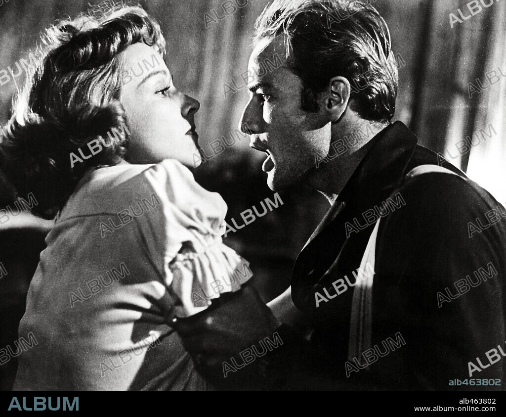 KIM HUNTER and MARLON BRANDO in A STREETCAR NAMED DESIRE, 1951, directed by ELIA KAZAN. Copyright WARNER BROTHERS.