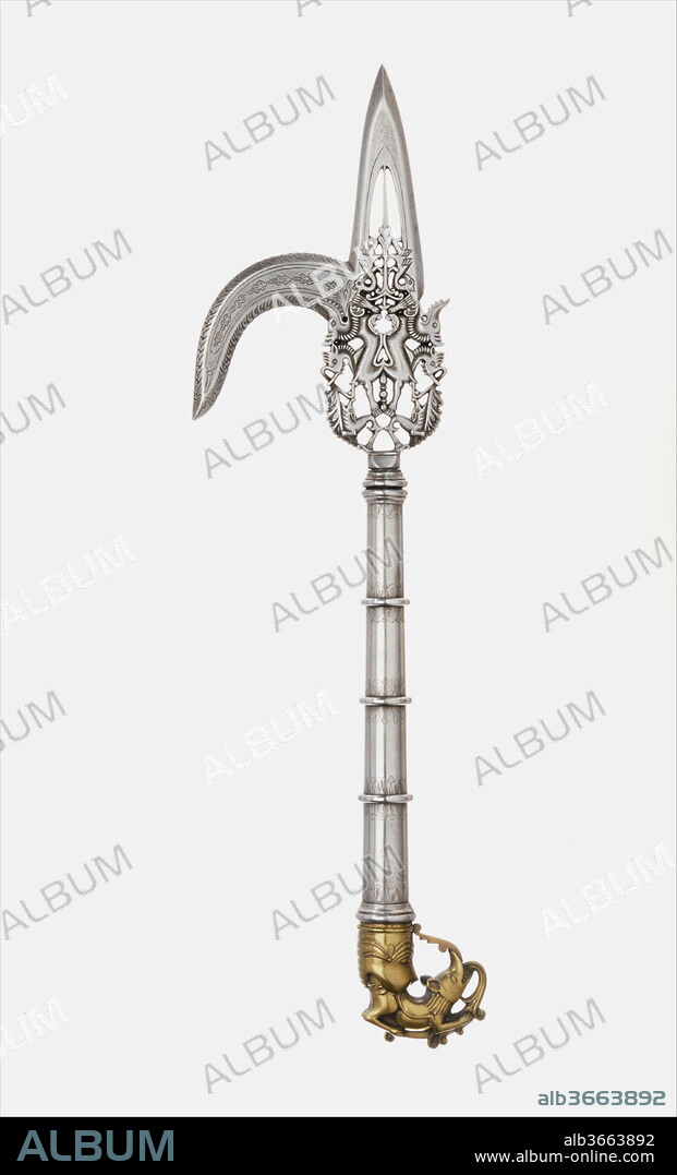 Elephant Goad (Ankus). Culture: South Indian. Dimensions: L. 16 in. (40.6 cm). Date: 17th century.
A goad is carried by the mahout or elephant driver. The sharp point and hook was used to guide the animal to behave or move in a specific way, making it a crucial tool for hunting expeditions. The steel blade here features fantastical creatures, while the brass butt is formed by a dog-like animal issuing from a tiger's mouth. Since it is ornately decorated, it may have also been intended for display in ceremonial processions.
