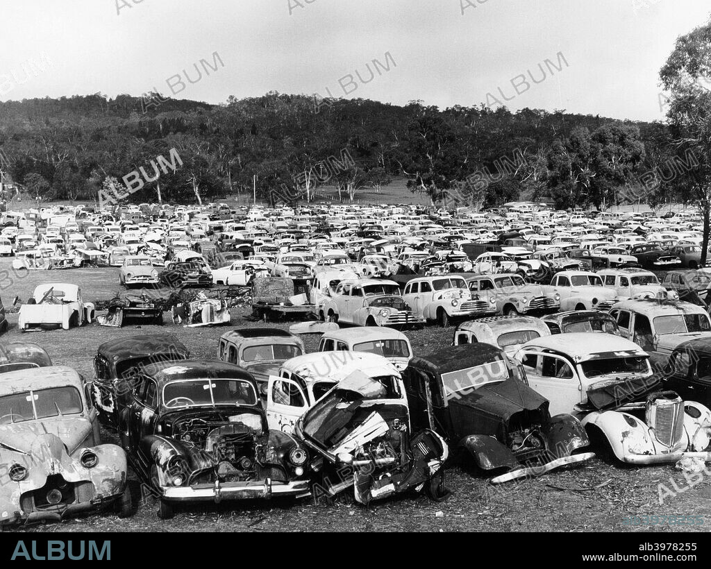 Old cars in Flynn's wrecking yard, Cooma, New South Wales, Australia, 1973.