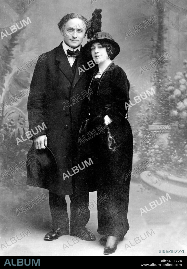 Harry Houdini (1874 - 1926) was a Hungarian-American illusionist and stunt performer, noted for his sensational escape acts. Houdini met Bess Rahner while performing at Coney Island. They married in 1894 and for the rest of Houdini's performing career, she worked as his stage assistant. No photographer credited, 1913 (cropped and cleaned).